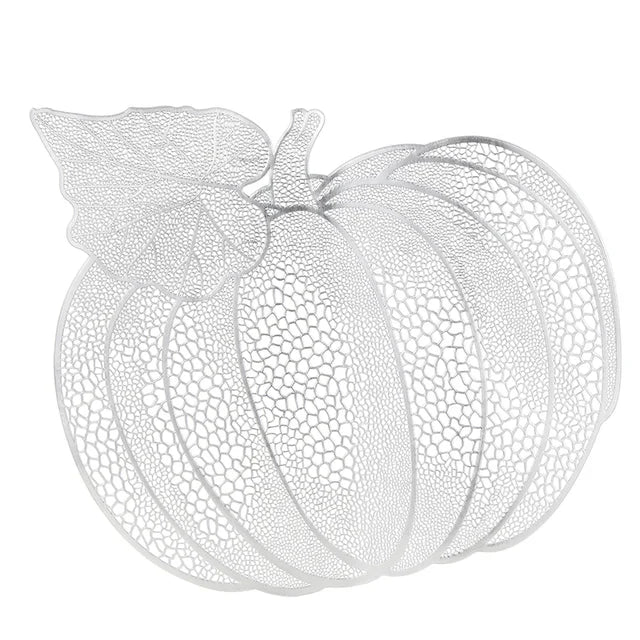 Pumpkin Vinyl Placemats by Allthingscurated are designed with perforated hollow patterns to create a unique texture and add dimension to your table setting. Made from durable PVC vinyl, they are stain-resistant and easy to maintain. Perfect for Thanksgiving and Halloween celebrations.  Featured here is placemat in silver.