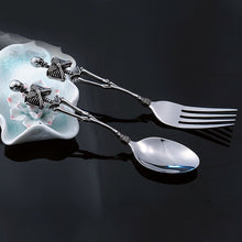 Load image into Gallery viewer, Skeleton Fork and Spoon by Allthingscurated offer a frightful but fun experience in your next dinner party. Crafted from stainless steel.
