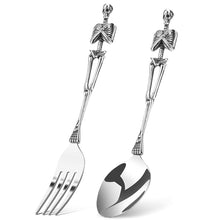 Load image into Gallery viewer, Skeleton Fork and Spoon by Allthingscurated offer a frightful but fun experience in your next dinner party. Crafted from stainless steel.  Featuring here is a fork and spoon set.
