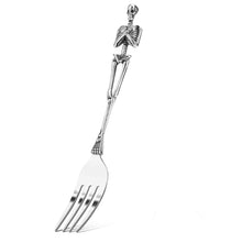 Load image into Gallery viewer, Skeleton Fork and Spoon by Allthingscurated offer a frightful but fun experience in your next dinner party. Crafted from stainless steel.  Featuring here is a fork.
