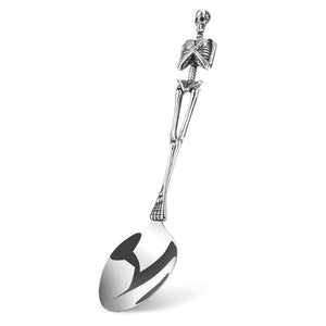 Skeleton Fork and Spoon by Allthingscurated offer a frightful but fun experience in your next dinner party. Crafted from stainless steel.  Featuring here is a spoon.