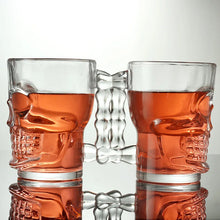 Load image into Gallery viewer, Skull Beer Mug by Allthingscurated blends functionality with style. Made with thickened glass with a heavy bottom for stability, it spots a fun, cool skull shape design that is ideal for Halloween or everyday use. The large capacity is perfect for beer or any beverage. Add this must-have mug to your drinkware collection and be ready for any gatherings or house parties.

