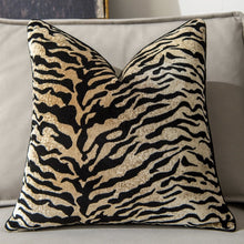 Load image into Gallery viewer, Glamorous Animal Prints Cushion Covers by Allthingscurated featured 6 animal print designs in tiger stripes, cheetah spots, zebra stripes and giraffe print. In a neutral palette and warm texture that work well with a variety of decorating styles. Timeless and chic, they are the perfect accessories to dress up with home with a wow factor. Comes in 2 square sizes of 45 by 45cm or 17.5 by 17.5 inches or 50 by 50cm or 19.5 by 19.5 inches. Featured here is our tiger print in light tan.
