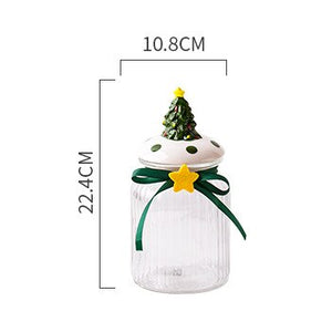 Christmas Festive Storage Jars by Allthingscurated are the perfect jars to keep all your festive treats fresh and delicious. The jars are airtight and each jar is topped with a ceramic lid decorated with a Santa Claus, Christmas Tree, Penguin, Gnome or Fox. Comes in 2 sizes with capacity of 300ml or 10 ounce and 1000ml or 34 ounce. Featured here is a large Christmas Tree jar.