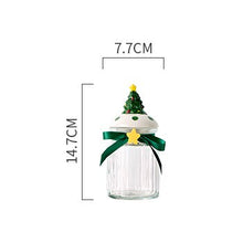 Load image into Gallery viewer, Christmas Festive Storage Jars by Allthingscurated are the perfect jars to keep all your festive treats fresh and delicious. The jars are airtight and each jar is topped with a ceramic lid decorated with a Santa Claus, Christmas Tree, Penguin, Gnome or Fox. Comes in 2 sizes with capacity of 300ml or 10 ounce and 1000ml or 34 ounce. Featured here is a small Christmas Tree jar.
