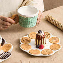 Load image into Gallery viewer, The Waffle Cup and Plate collection by Allthingscurated features a charming waffle pattern and whimsical biscuit design that will bring a smile to your breakfast. Each piece is hand painted on porcelain. Perfect for breakfast and tea time. Makes a great gift for any occasion. Cup and plate each comes in 4 designs to choose from.
