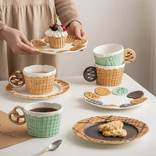 Load image into Gallery viewer, The Waffle Cup and Plate collection by Allthingscurated features a charming waffle pattern and whimsical biscuit design that will bring a smile to your breakfast. Each piece is hand painted on porcelain. Perfect for breakfast and tea time. Makes a great gift for any occasion. Cup and plate each comes in 4 designs to choose from.
