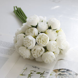 Silk Peony Bouquets by Allthingscurated are made of soft, realistic silk in 6 lovely colors to last through all seasons. Perfect for home décor or as a romantic wedding bouquet. Featured here is the color White.
