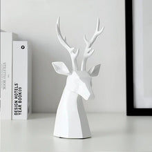 Load image into Gallery viewer, This beautiful Deer Head Bust sculpture is made of resin and comes available in 4 colors of black, white, gray and teal.  Measuring 26cm or 10 inches in height and 11.5cm or 4.5 inches in width. This figurine spots a contemporary design with sculptural form inspired by Origami. This decorative piece will add timeless elegance to your space year-round. Perfect for festive tablescapes, mantels and shelves.  This is a deer head bust in White.
