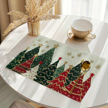 Load image into Gallery viewer, Placemat with Christmas tree design on a table with a cup and spoon.
