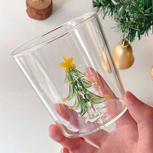Christmas Tree Drinking Glass by Allthingscurated has a playful and whimsical design, featuring a sculptural 3D Christmas Tree within the tumbler. The tree comes in a 2 colors, green and white. Measuring 8.5cm or 3.3 inches in width at the top, 9cm or 3.5 inches in height and 6.5cm or 2.5 inches in width at the base, the drinking glass has a capacity of 300ml or 10 ounce. Featured here is one with a green Christmas Tree.