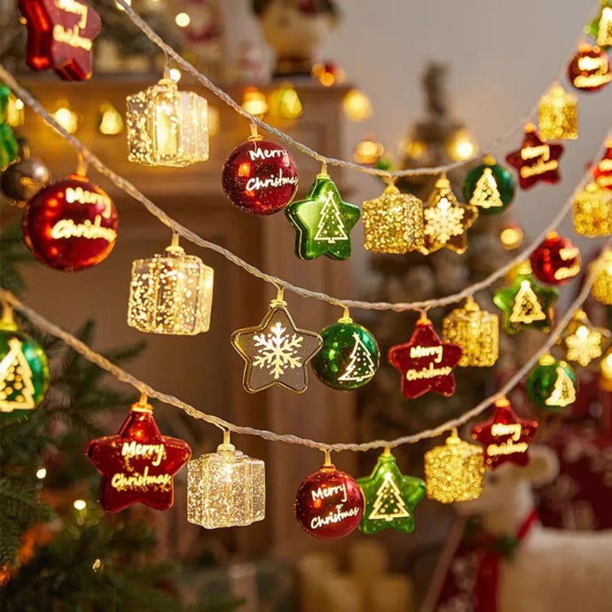 Transform your space into a vibrant holiday haven with these Christmas Decorative LED String Lights from Allthingscurated. Featuring fun gift box, stars and round bauble to add warmth and magical sparkle to your space and tree. Comes in 2 lengths consisting of 10 or 20 LED lights.