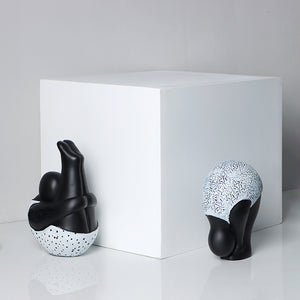 Roly-Poly-Dolly Yoga Figurines by Allthingscurated. Crafted from resin and featuring stylized volumetric figures that are characteristically rotund in shape and flexible, these artfully-designed unique pieces feature timeless black and white female figures in yoga poses.  Available in 2 styles of poses, Standing Forwarding Bend and Sitting Forward Bend.
