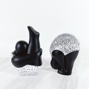 Roly-Poly-Dolly Yoga Figurines by Allthingscurated. Crafted from resin and featuring stylized volumetric figures that are characteristically rotund in shape and flexible, these artfully-designed unique pieces feature timeless black and white female figures in yoga poses.  Available in 2 styles of poses, Standing Forwarding Bend and Sitting Forward Bend.
