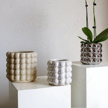 Load image into Gallery viewer, Zayla Bubble Planters by Allthingscurated are made from ceramic. These planters feature a chic design with striking 3D bubble exterior that looks sophisticated and will transform the look of your beloved indoor plants effortlessly. Come in 2 sizes and available in 3 colors that will complement any modern home décor styles.
