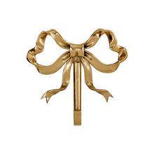 Load image into Gallery viewer, These pretty wall hooks by Allthingscurated are made of high-quality brass with a vintage gold finish.  Fashioned like a bow tied with ribbon, it’s feminine and perfect for the walk-in wardrobe or powder room. Comes in small and large size. Small hook measures 7.3cm or 2.8 inches in height and 6.5cm or 2.5 inches in width. Large hook measures 10.3cm or 4 inches in height and 9.5cm or 3.7 inches in width. Sold as individual hooks or a set of small and large hooks. This is a large hook.
