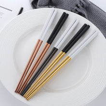Load image into Gallery viewer, These Chinese chopsticks by Allthingscurated is contemporary with a square design for better food gripping. Made of 304 food grade stainless steel, they come in 6 different color combinations of Black and Gold, Black and Rose Gold, Black and Silver, White and Black, White and Gold, White and Rose Gold. Retailed as a set of 6 pairs, choose from one of the above color combinations or opt for an assorted set of 6 different color combinations. Chopstick length is 23.5cm or 9 inches.
