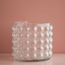 Load image into Gallery viewer, Zayla Bubble Vase by Allthingscurated features a geometric bubble design. The eye-catching detail and design are enough to make it a statement centerpiece with or without floral display. Comes in black or clear and in 2 sizes. The short vase measures 17cm or 6.6 inches in height and 16cm or 6.2 inches in diameter.  The tall vase measures 27.5cm or 10.7 inches in height and 13cm or 5 inches in diameter. This is a pair of clear vases with small pink flowers in the tall vase. This is a short clear vase.
