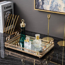 Load image into Gallery viewer, Donatella Mirror tray by Allthingscurated features a mirror surface and intricate gold-gilded pattern surround all sides of the rectangle tray and with 2 handles. Available in small, medium and large size.  Featuring here is a large rectangle tray with 3 perfume bottles.
