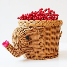 Load image into Gallery viewer, Allthingscurated elephant shape rattan basket in dark caramel color. Measuring height 16cm, diameter 20cm and width 30cm. Ideal as a storage basket or as a pot holder for your houseplant.
