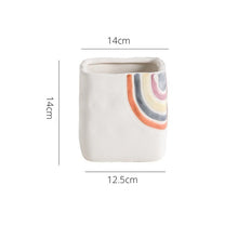 Load image into Gallery viewer, Biba Ceramic Square Planter by Allthingscurated features hand-painted rainbow-like pattern on a creamy white background with a groovy and hippie vibe. Available in small, medium and large size. This is a large pot measuring 14cm by 14cm or 5.5 inches by 5.5 inches.
