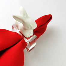 Load image into Gallery viewer, Porcelain Rabbit Napkin Holder by Allthingscurated comes as a set of 4 holders.  Made of white porcelain for the rabbit which sits atop the high-quality acrylic holder. Perfect for Easter.
