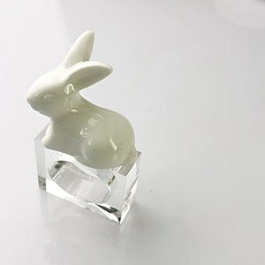 Porcelain Rabbit Napkin Holder by Allthingscurated comes as a set of 4 holders.  Made of white porcelain for the rabbit which sits atop the high-quality acrylic holder. Perfect for Easter.