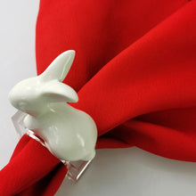 Load image into Gallery viewer, Porcelain Rabbit Napkin Holder by Allthingscurated comes as a set of 4 holders.  Made of white porcelain for the rabbit which sits atop the high-quality acrylic holder. Perfect for Easter.
