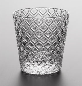 Carven geometric glass tumblers by Allthingscurated spots a unique design resembling the exterior of a pineapple.  An elegant and charming drinkware for serving cocktails, whiskey and sangria to you guests. Come available in clear or iridescent glass with height measuring 7.6cm or 3 inches by top diameter of 7.3cm or 2.8 inches and base diameter of 5.2cm or 2 inches.  This is a clear tumbler