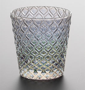Carven geometric glass tumblers by Allthingscurated spots a unique design resembling the exterior of a pineapple.  An elegant and charming drinkware for serving cocktails, whiskey and sangria to you guests. Come available in clear or iridescent glass with height measuring 7.6cm or 3 inches by top diameter of 7.3cm or 2.8 inches and base diameter of 5.2cm or 2 inches.  This is an iridescent tumbler.