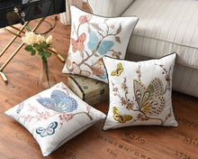 Load image into Gallery viewer, Allthingscurated Spring Harmony Cushion Cover Collection in garden-inspired theme featuring butterflies, florals and birds in embroidering in 100% cotton fabric. Measuring 45 x 45cm or 18 x 18 inches. Available in 7 designs.
