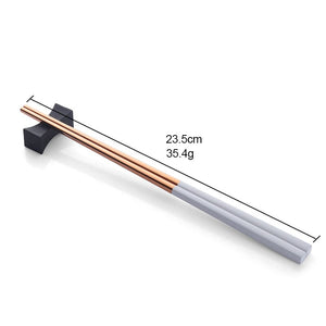 Allthingscurated Chinese Chopsticks in a set of 6 pairs in White and Rose Gold color combination.