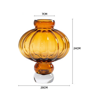 Luna Lantern Vase in Amber by Allthingscurated in small size. Measuring 24cm or 9.4 inches in height and 20cm or 7.8 inches in width. Top opening measures 7cm or 2.7 inches.