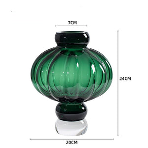 Luna Lantern Vase in Green by Allthingscurated in small size. Measuring 24cm or 9.4 inches in height and 20cm or 7.8 inches in width. Top opening measures 7cm or 2.7 inches.