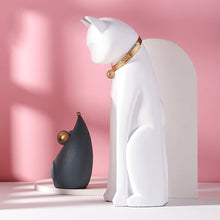 Load image into Gallery viewer, White cat and grey mouse looking into each other peacefully with a lovely pink background.

