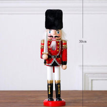 Load image into Gallery viewer, Christmas Nutcracker Toy Soldier Guard wearing Red Uniform holding a sword in his right hand. Standing at 30cm or 11.7 inches.
