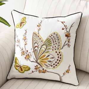 Allthingscurated Spring Harmony Cushion Cover Collection in garden-inspired theme featuring butterflies, florals and birds in embroidering in 100% cotton fabric. Measuring 45 x 45cm or 18 x 18 inches. Available in 7 designs. Shown here Butterly in brown and yellow Design D.