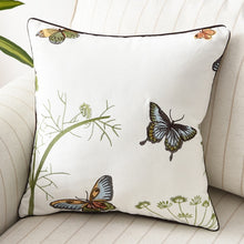 Load image into Gallery viewer, Allthingscurated Spring Harmony Cushion Cover Collection in garden-inspired theme featuring butterflies, florals and birds in embroidering in 100% cotton fabric. Measuring 45 x 45cm or 18 x 18 inches. Available in 7 designs.  Shown here Butterflies in blue, brown and yellow Design E. 
