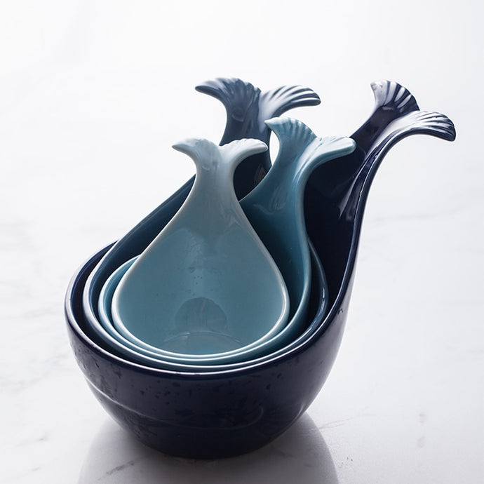 Allthingscurated Blue Whale Bowl Set consisting of 4 bowls in sizes from small to extra-large.