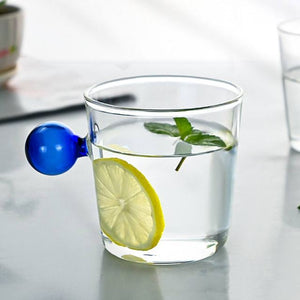 Drinking Glass with colored spherical handle in cobalt blue, measuring 8.5 x 8.5 x 7cm or 3.3 x 3.3 x 3 inches with a capacity of 350ml or 11.8 ounce.