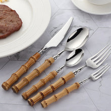 Load image into Gallery viewer, Allthingscurated Natural Bamboo Cutlery Set consisting of 1 dinner knife, 1 dinner spoon, 1 dinner fork, 1 teaspoon and 1 fruit fork. Available in 5-piece set for 1 person, or 20-piece set for 4 persons and 30-piece set for 6 persons. Made of 18/10 stainless steel and natural bamboo for handle.
