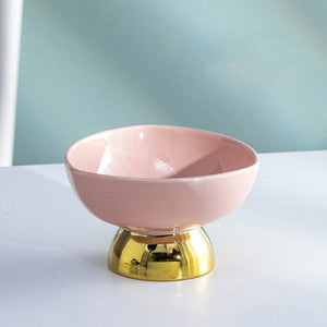 Allthingscurated footed dessert bowl measuring height 7.5cm and diameter 12.3cm. Made of glazed porcelain in  pink.