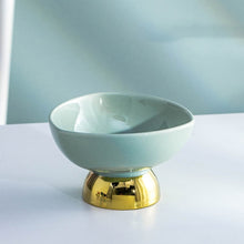 Load image into Gallery viewer, Allthingscurated footed dessert bowl measuring height 7.5cm and diameter 12.3cm. Made of glazed porcelain in light green.
