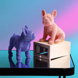 Allthingscurated French Bulldog figurine crafted in resin with a fashionable coat of pearly texture in standing or sitting pose. Available as a sitting bulldog in Pink and Purple, and standing bulldog in Orange and Blue.